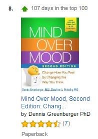 screenshot from amazon canada showing mind over mood second edition ranked number 8 in the top 100 books and listing it as 107 days in the top 100
